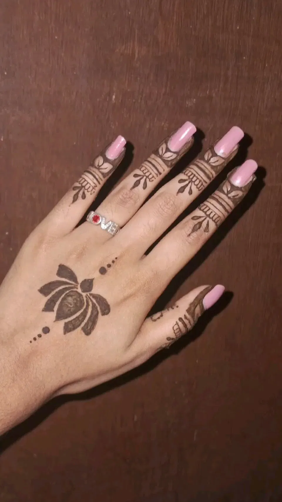 Aesthetic Minimal Back Hand Mehndi Design with Deity and Lotus