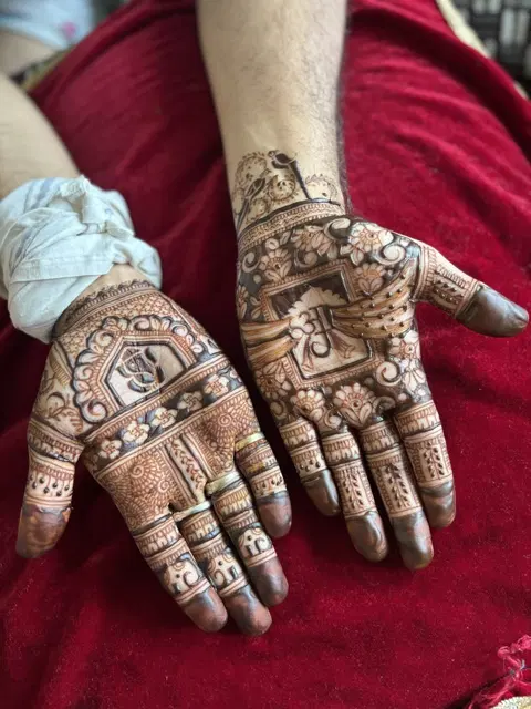 bridal royal deity back hand mehndi design
