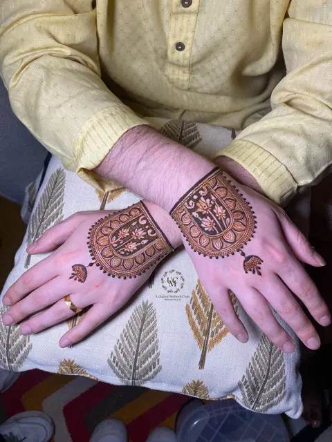 bridal royal deity back hand mehndi design