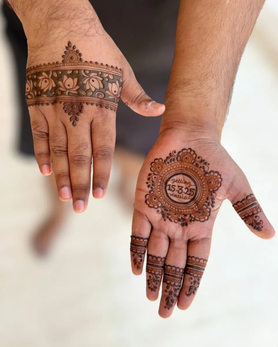Royal Simple Back Hand Mehndi Design with Gol Tikki, Deity and Jaal for Engagement