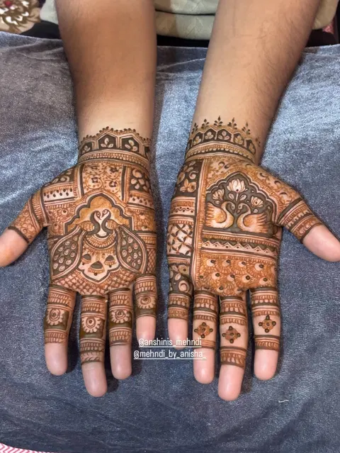 bridal royal deity back hand mehndi design
