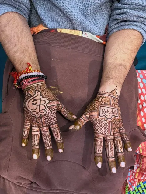 bridal royal deity back hand mehndi design