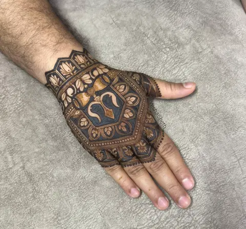 dubai indian deity back hand mehndi design
