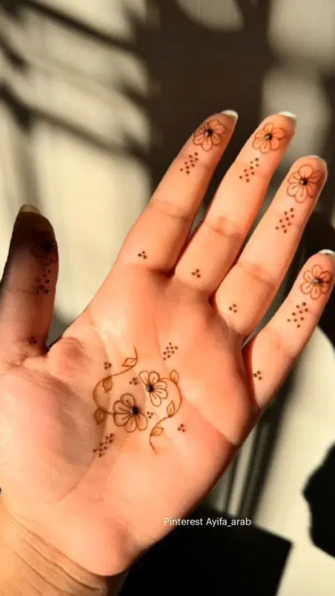 aesthetic minimal flower finger mehndi design