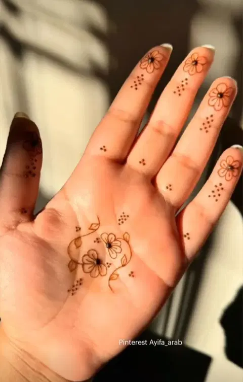 aesthetic minimal flower finger mehndi design