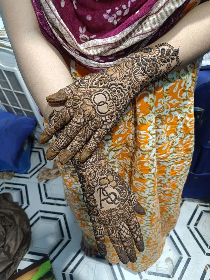 Bridal Back Hand Mehndi Design with Hidden Name for Engagement