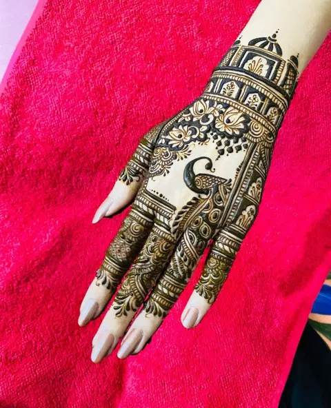bridal indo-arabic peacock back hand mehndi design