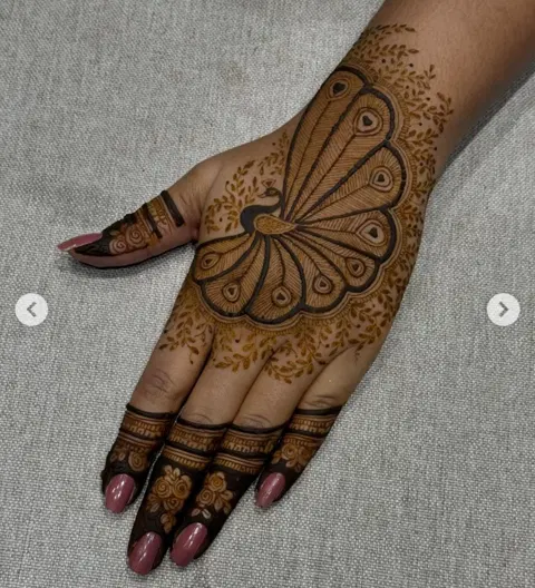 stylish butterfly back hand mehndi design