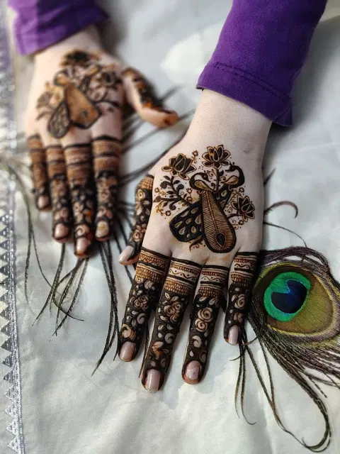 aesthetic bridal peacock back hand mehndi design