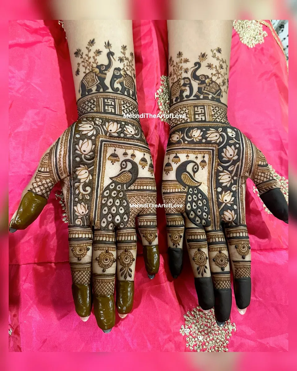 Royal Stylish Back Hand Mehndi Design with Figures and Lotus
