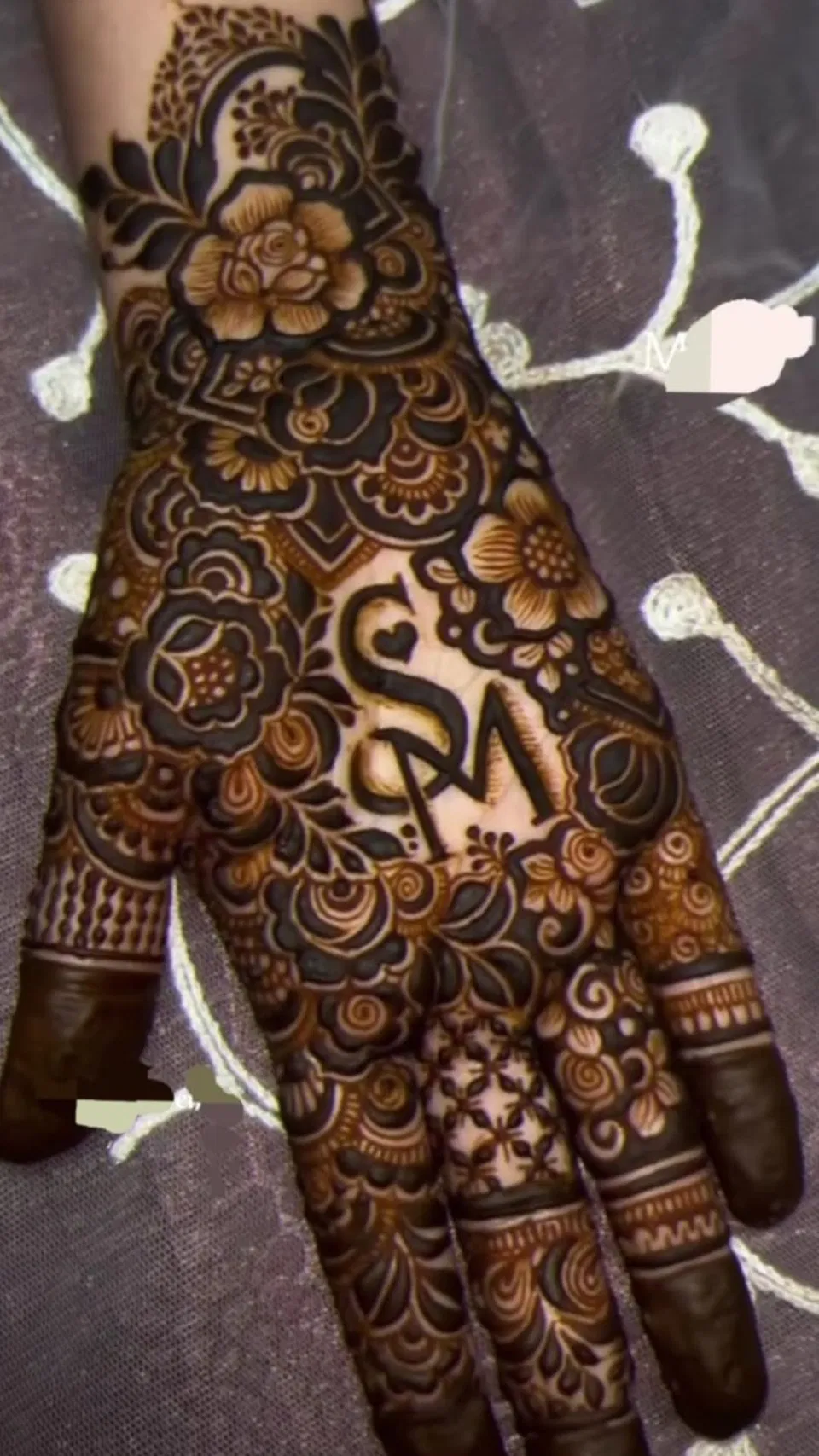 Bridal Back Hand Mehndi Design with Flowers and Hidden Name