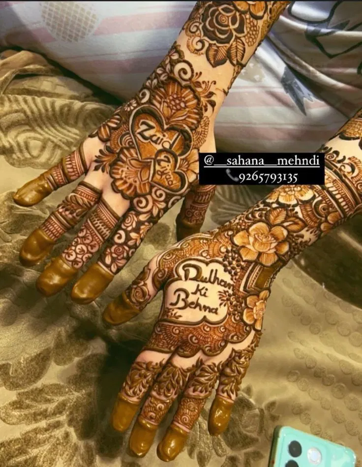 Bridal Back Hand Mehndi Design with Figures, Hearts and Hidden Name for Engagement