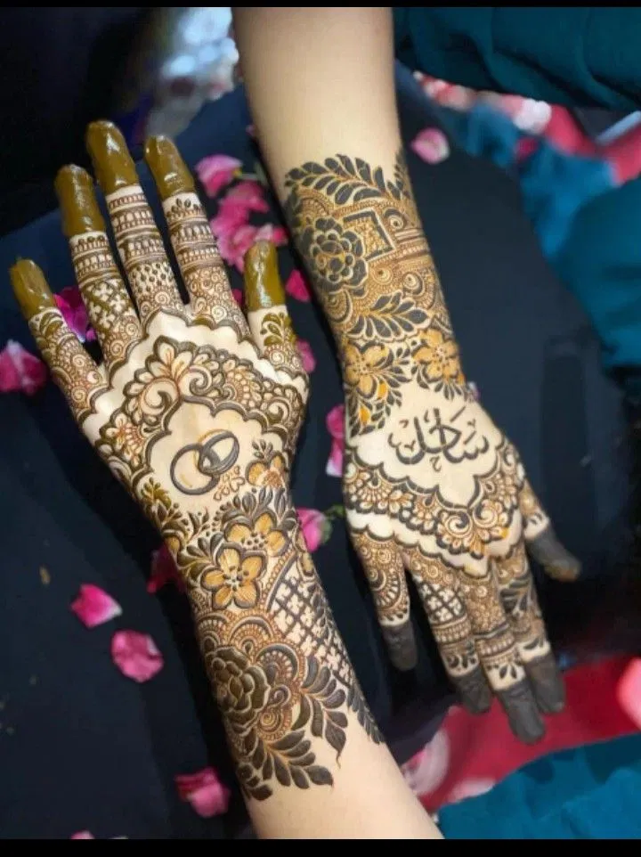Bridal Simple Back Hand Mehndi Design with Deity, Figures and Hidden Name for Engagement