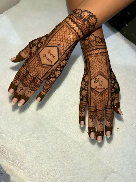 bridal royal figure back hand mehndi design