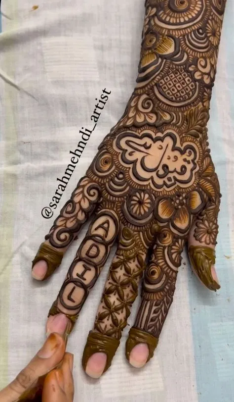 Bridal Dubai Back Hand Mehndi Design with Deity and Hearts