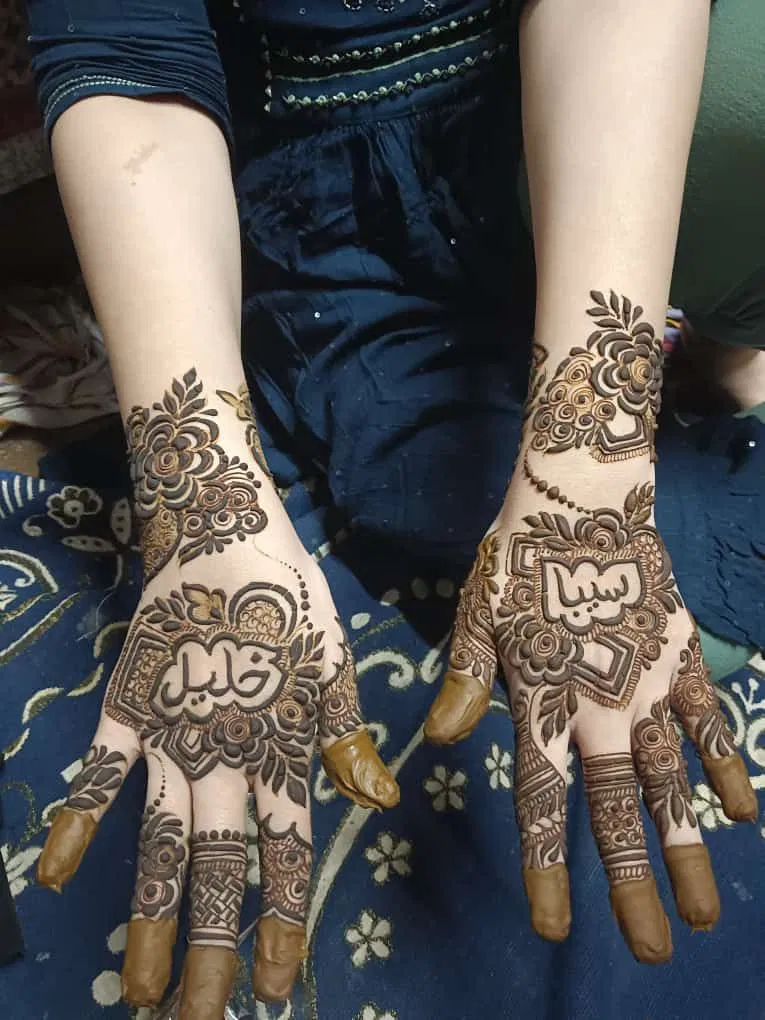 Simple Back Hand Mehndi Design with Figures, Jaal and Hidden Name