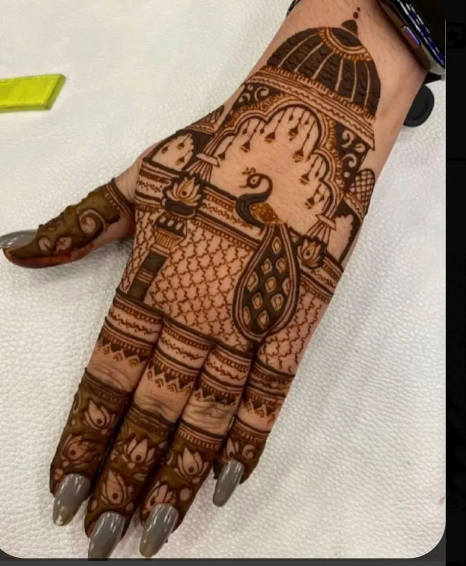 Royal Stylish Back Hand Mehndi Design with Figures for Raksha Bandhan