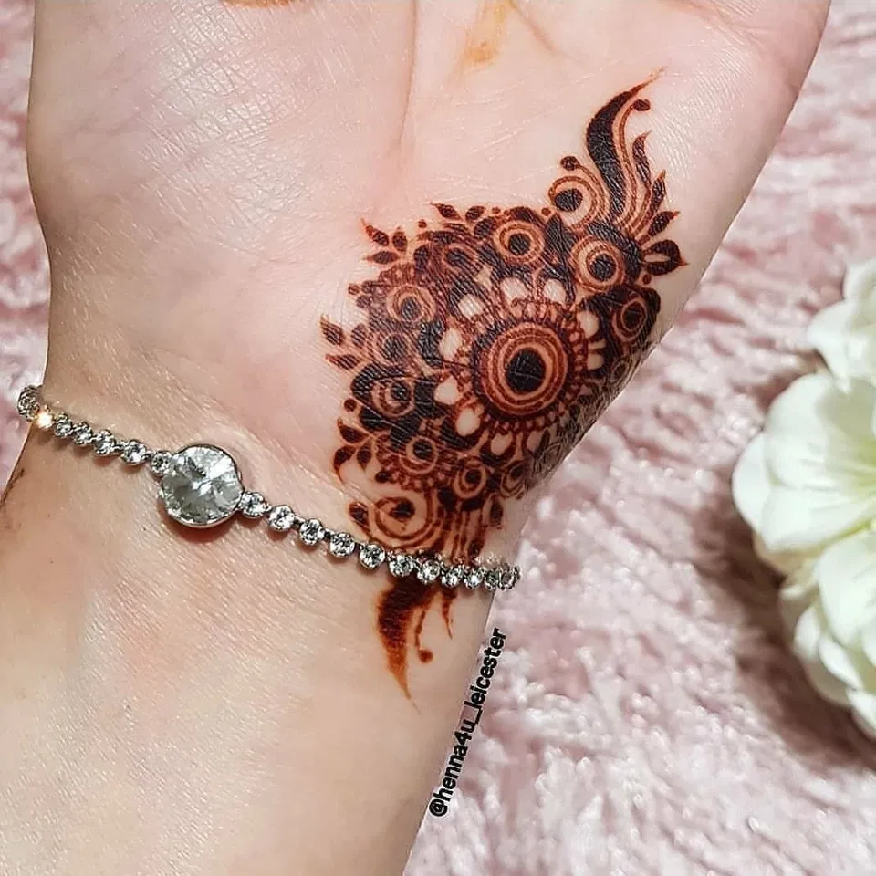 Stylish Back Hand Mehndi Design with Gol Tikki and Flowers