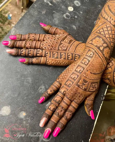 aesthetic bridal figure back hand mehndi design