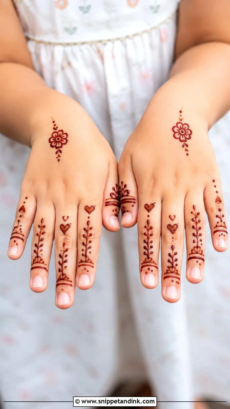 Aesthetic Minimal Back Hand Mehndi Design with Hearts and Jaal