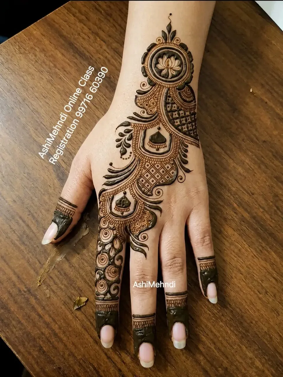Aesthetic Arabic Back Hand Mehndi Design with Gol Tikki and Flowers (49)