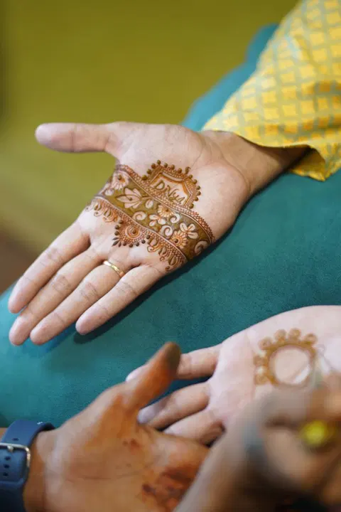 bridal minimal deity front hand mehndi design