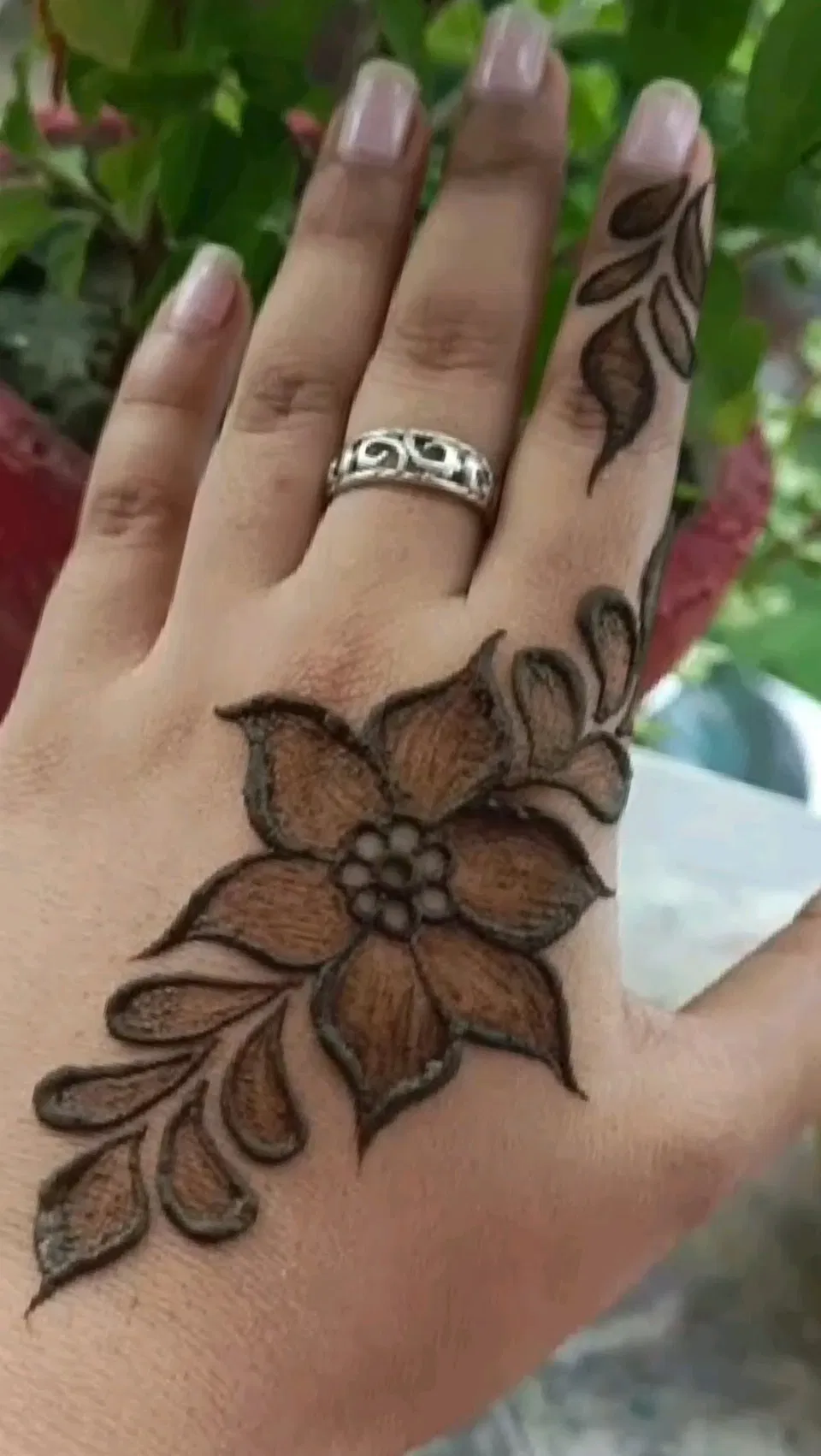Arabic Minimal Back Hand Mehndi Design with Gol Tikki and Flowers
