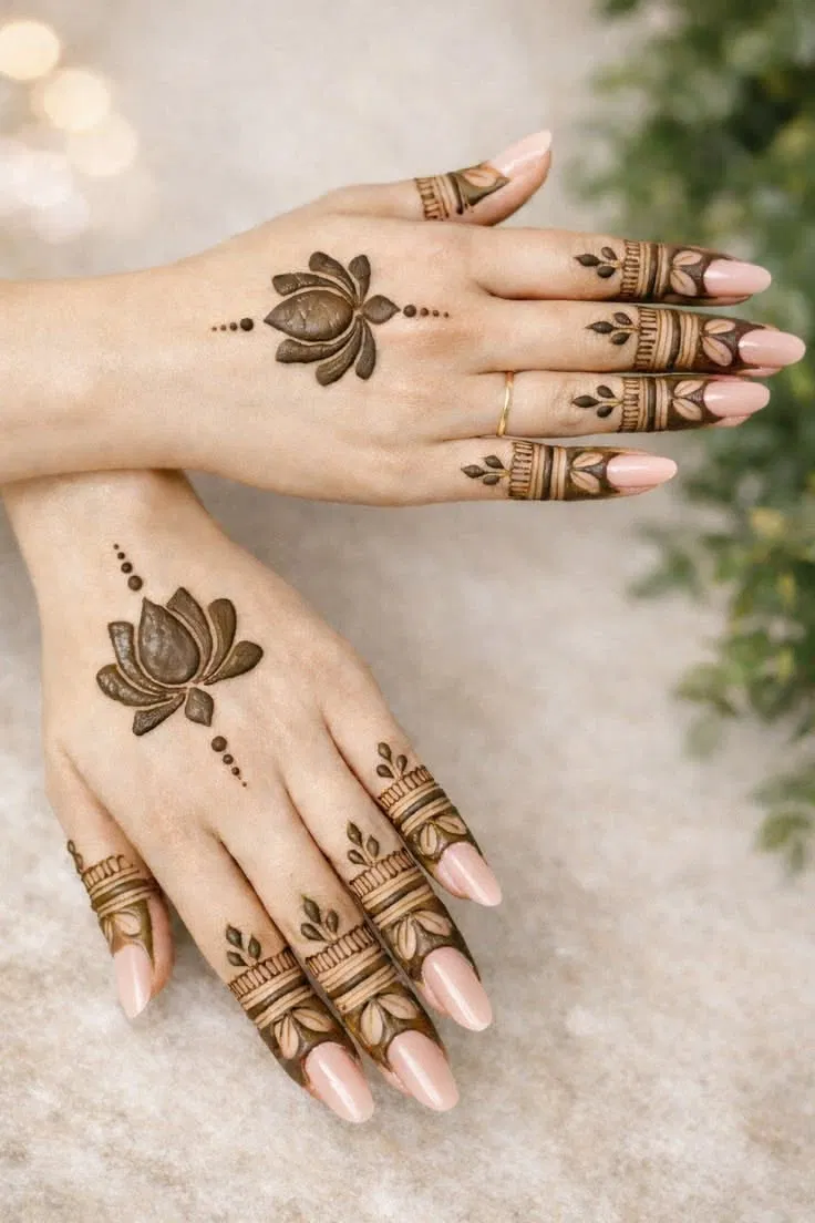 Aesthetic Minimal Back Hand Mehndi Design with Gol Tikki, Flowers and Lotus for Engagement