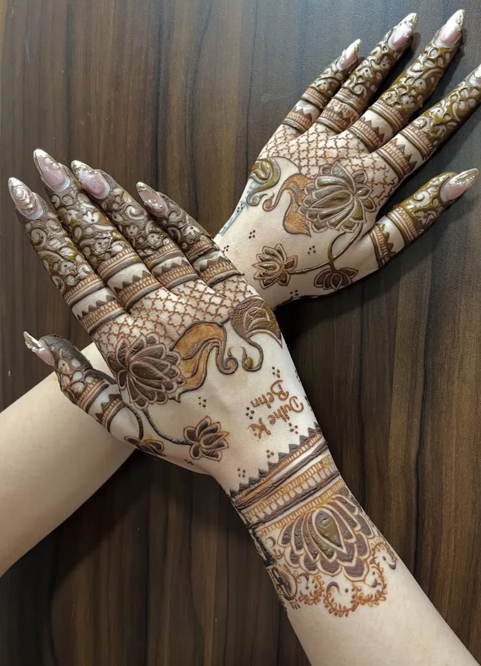 Aesthetic Bridal Back Hand Mehndi Design with Gol Tikki, Figures and Lotus